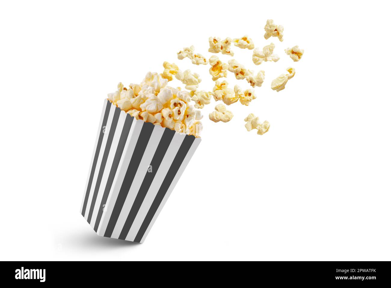 Popcorn flying out of black white striped paper box isolated on white