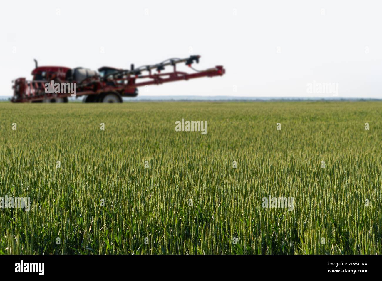 Machine for spraying pesticides and herbicides on the field. High quality photo Stock Photo