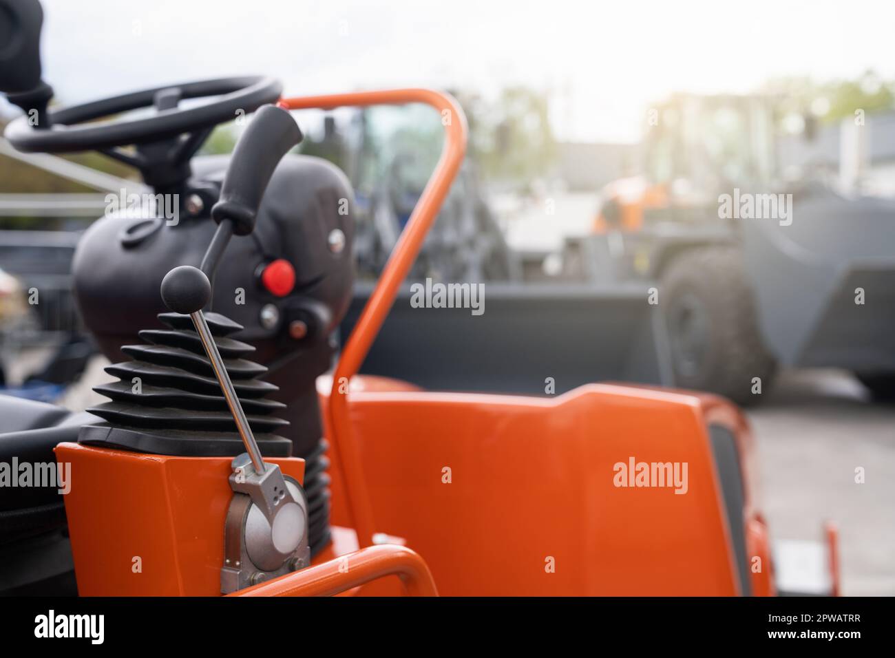 Steering wheel and joystick to drive a tractor. High quality photo Stock Photo
