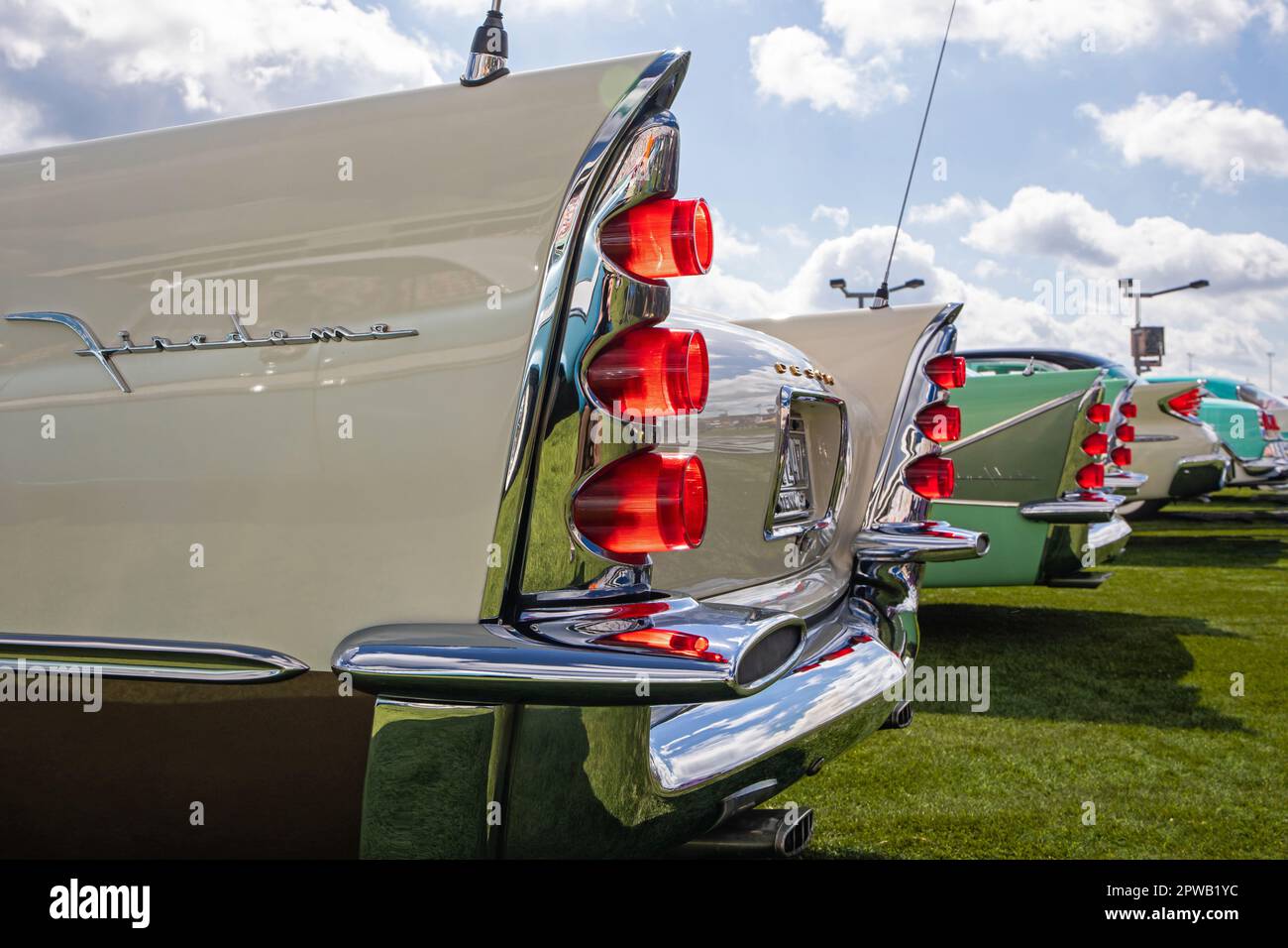 A row of classic DeSoto automobile tail fins from 1957, 1958, 1960 and 1955 on display at a classic car show. Stock Photo