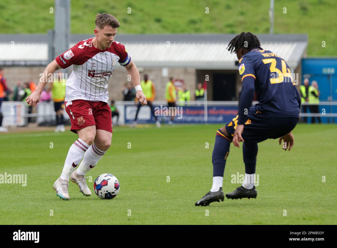 Northampton Town's captain Sam Hoskins takes on Bradford City's Thierry Nevers during the first half of the Sky Bet League 2 match between Northampton Town and Bradford City at the PTS Academy Stadium, Northampton on Saturday 29th April 2023. (Photo: John Cripps | MI News) Credit: MI News & Sport /Alamy Live News Stock Photo