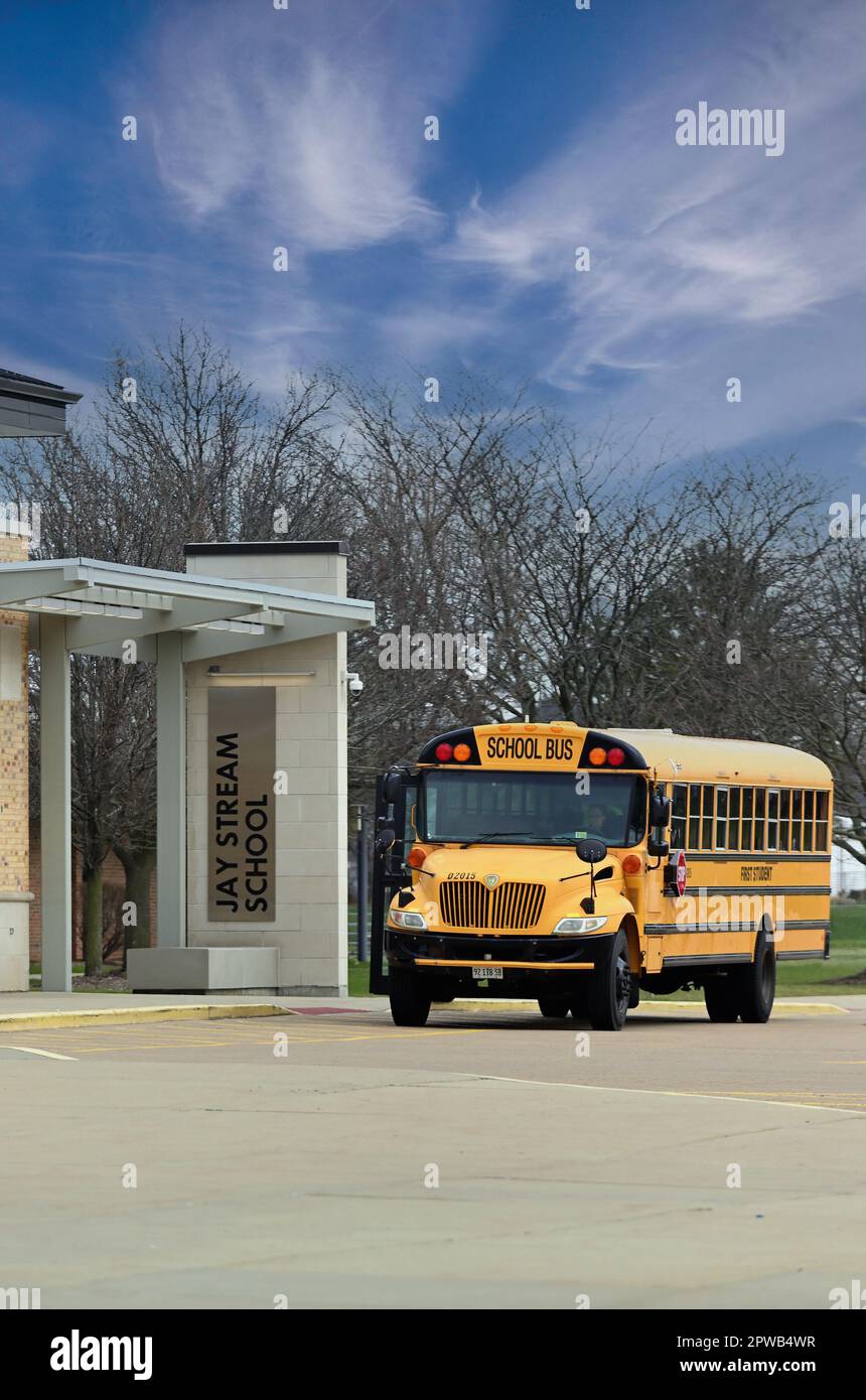 Carol Stream, Illinois, USA. A school bus waiting for passengers by an