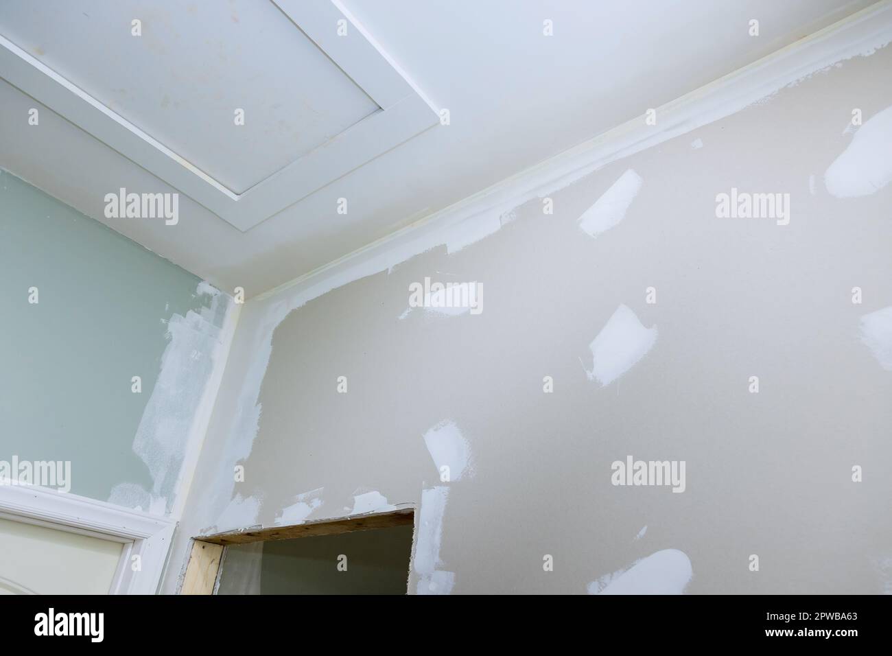 Walls of newly constructed house are in process being plastered with