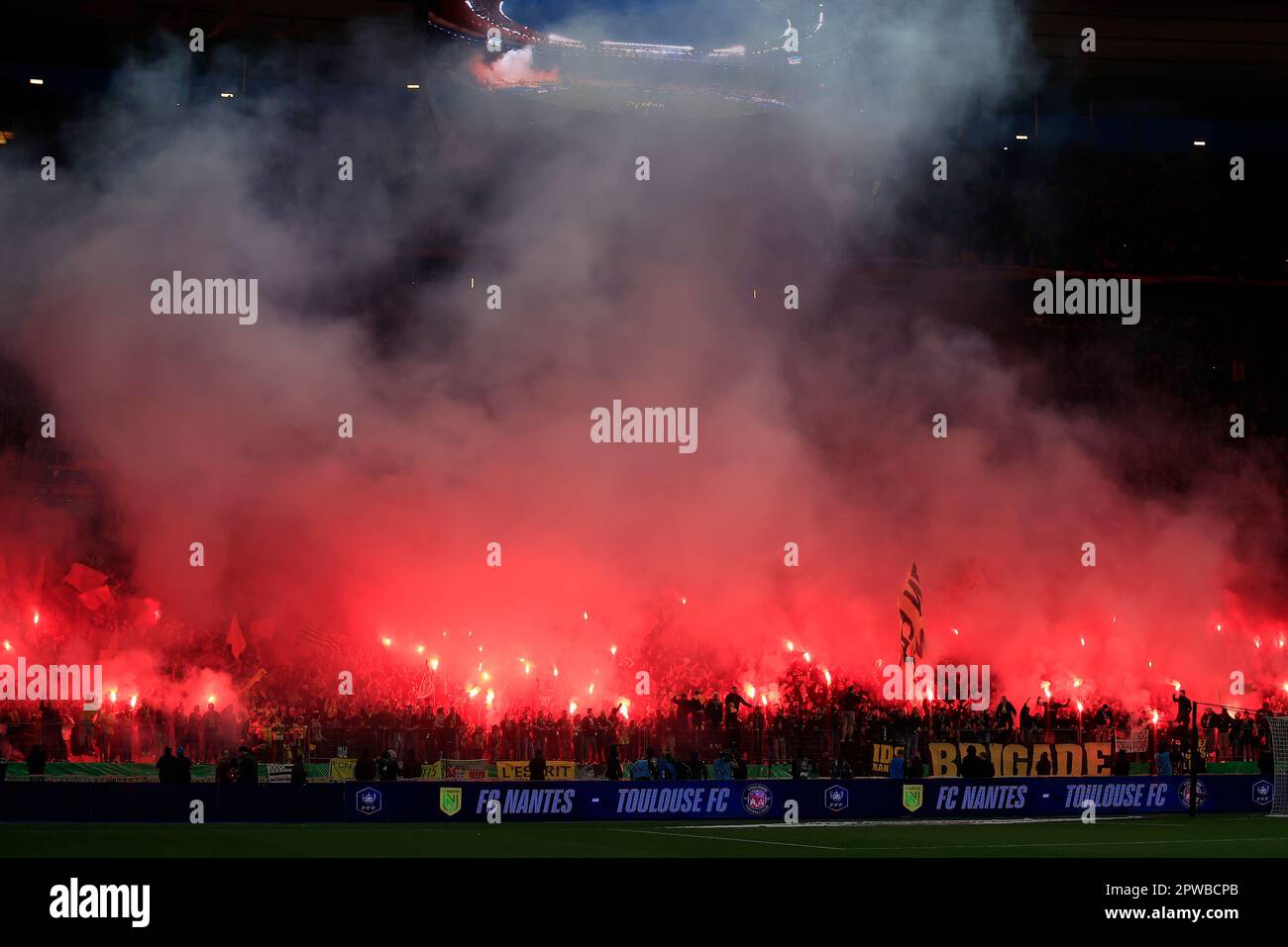 Nantes fans light flares and wave flags before the French Cup final soccer match between Nantes
