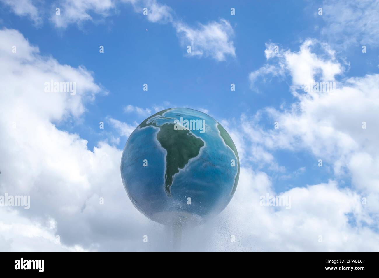 Structure of planet earth with blue sky and clouds in the background ...