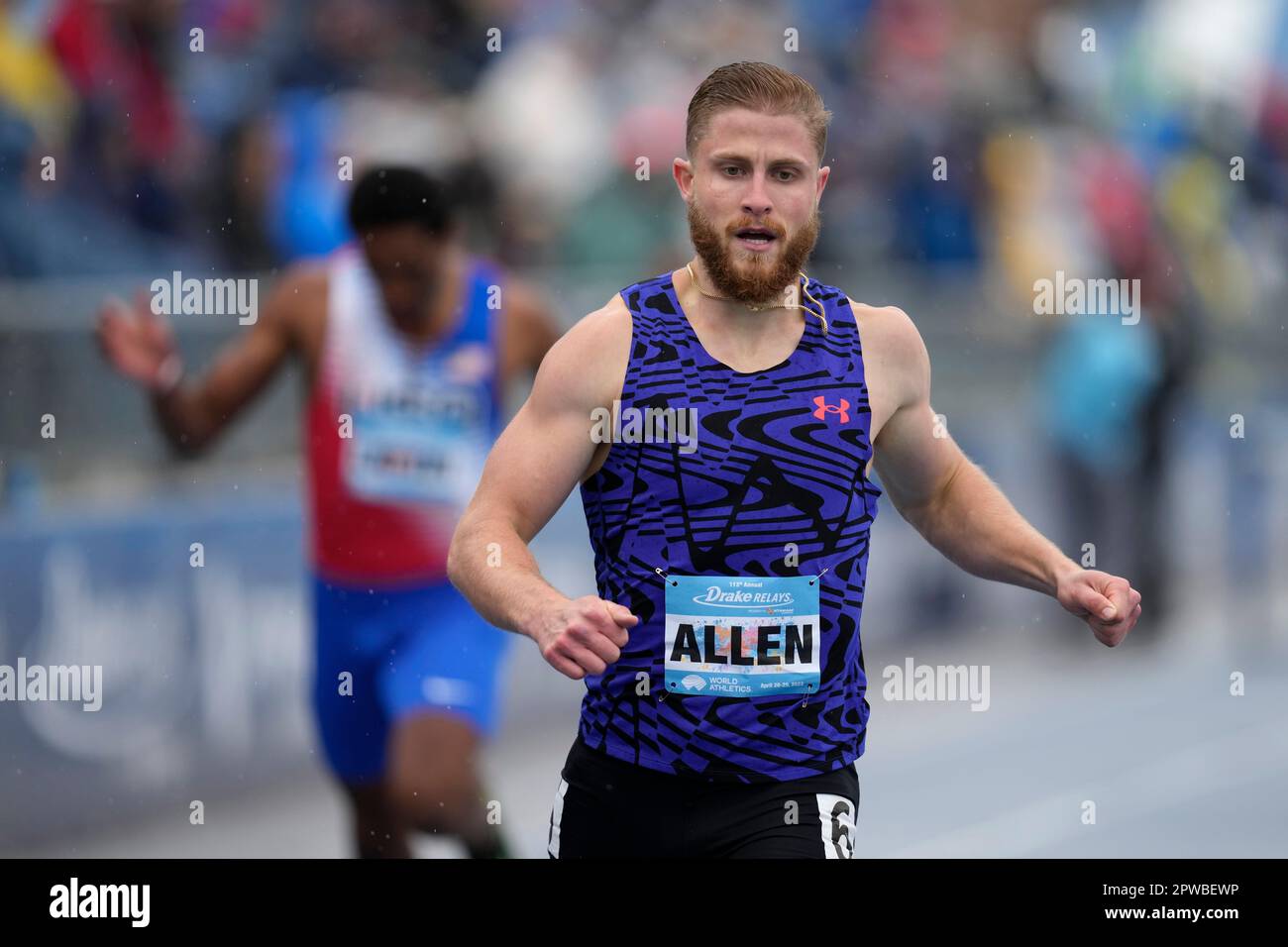 CJ Allen crosses the finish line as he wins the men's invitational 400