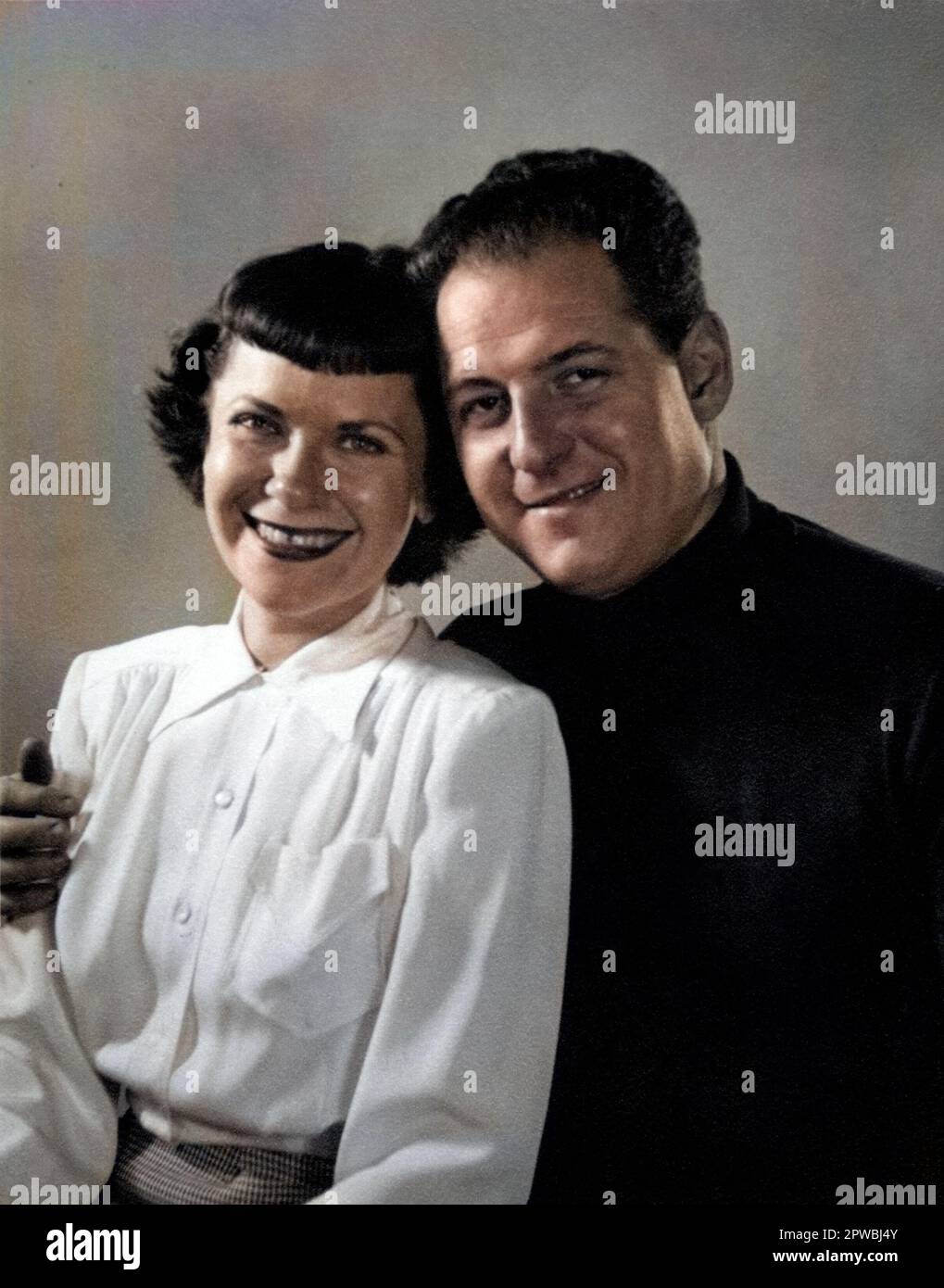 Archival photograph of a happy couple posing for a portrait, circa 1940s-1950s. Stock Photo