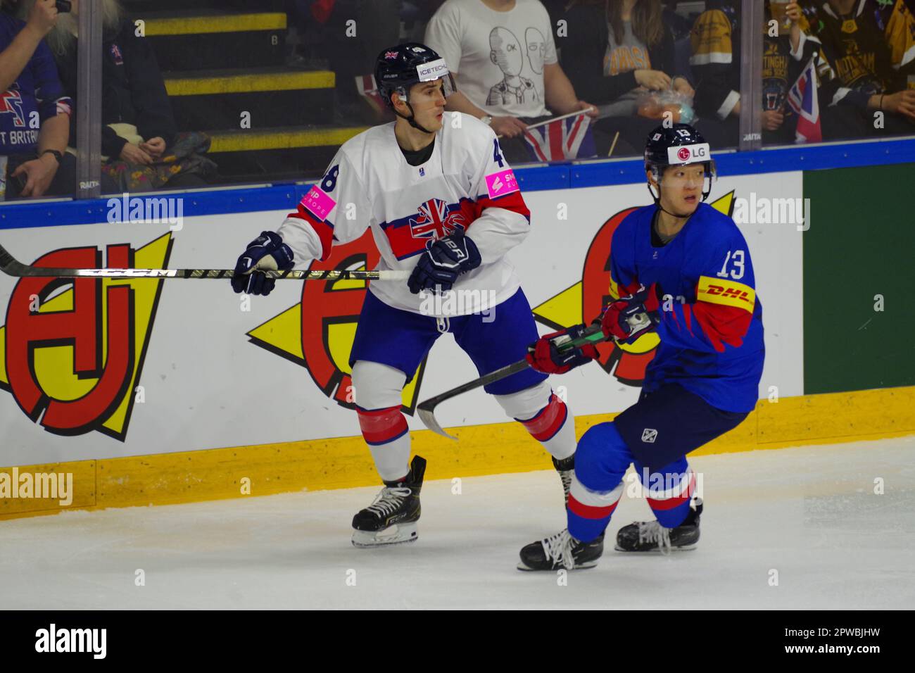 Nottingham, UK. 29 April 2023. Johnny Curran playing for Great Britain and Young Jun Lee playing for Korea during a match in the 2023 IIHF Ice Hockey World Championship, Division I, Group A tournament at the Motorpoint Arena, Nottingham.  Credit: Colin Edwards/Alamy Live News Stock Photo