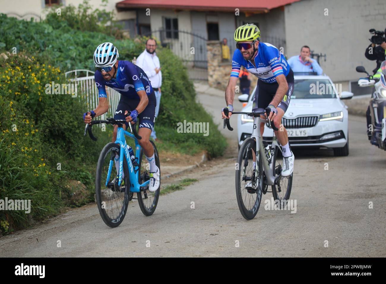 Las Tiendas, Spain, 29th April, 2023: Movistar Team rider Ivan Ramiro Sosa (L) suffers next to Damien Howson (Q36.5 Pro Cycling Team, R) during the 2nd stage of the Vuelta a Asturias 2023 between Candas and Cangas del Narcea, on April 29, 2023, in Las Tiendas, Spain. Credit: Alberto Brevers / Alamy Live News Stock Photo