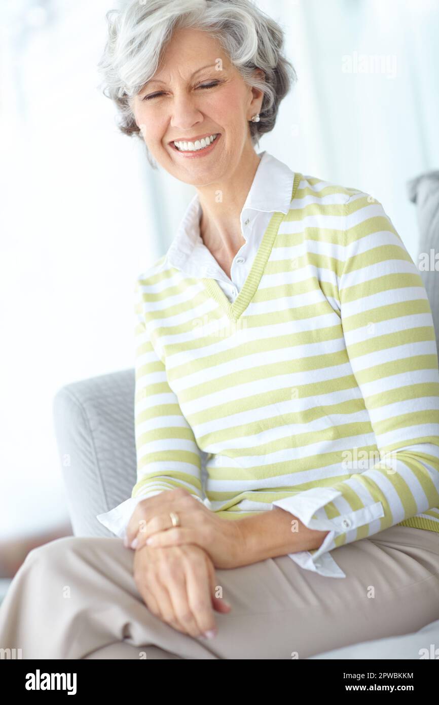 Old woman sitting alone sofa hi-res stock photography and images - Alamy