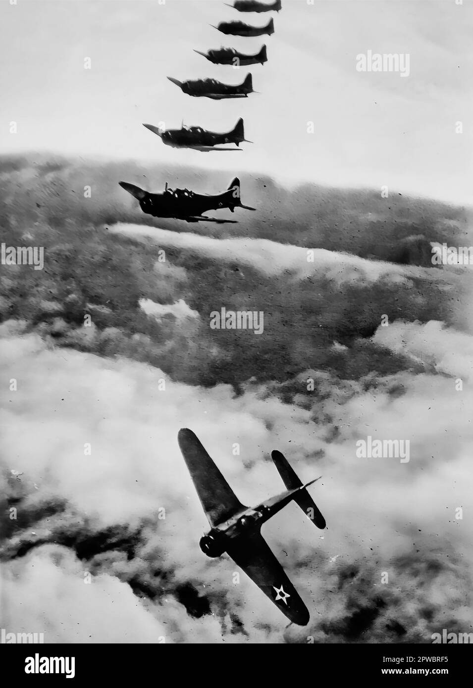 An image of a flight of Douglas SBD-1 dive bombers.  Built between 1940 and 1944 they played an important role in The Battle of Midway in 1942. Stock Photo