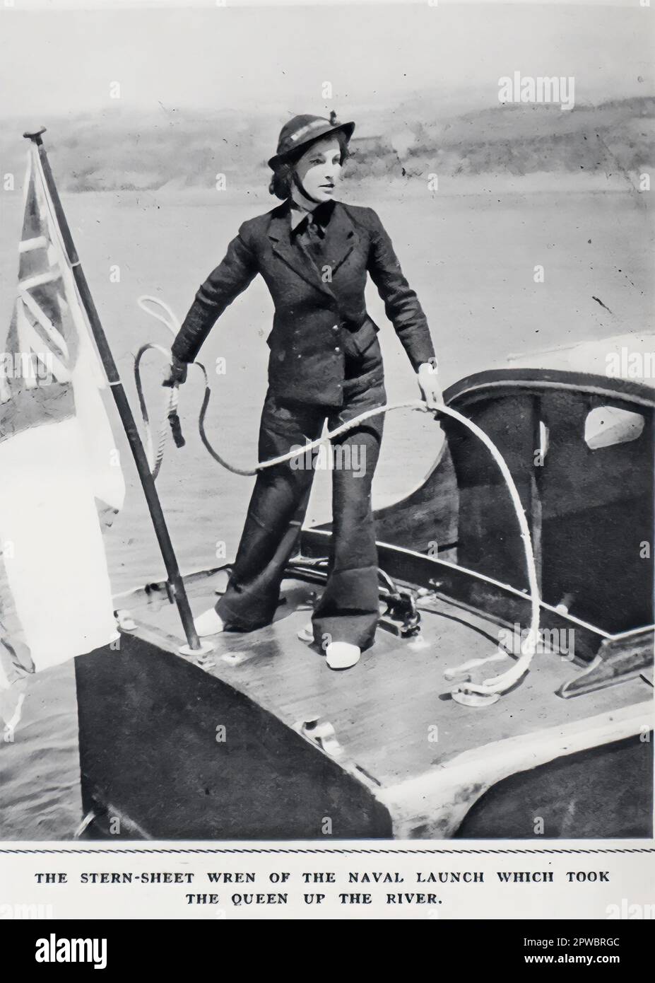 In 1942 The Queen boarded a naval vessel manned entirely by Wrens. It was the first occasion the Queens Standard  was broken on a naval vessel. Image from the Illustrated London News. Stock Photo
