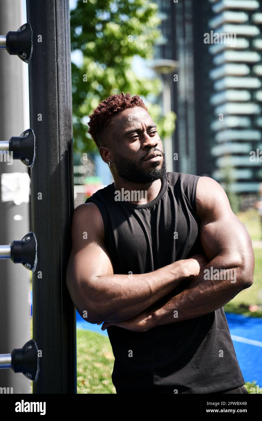Confident fit sporty young black man standing outdoors. Stock Photo