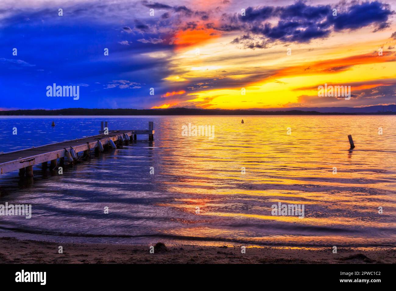Reflection of setting sun light on surface of Lake macquarie off