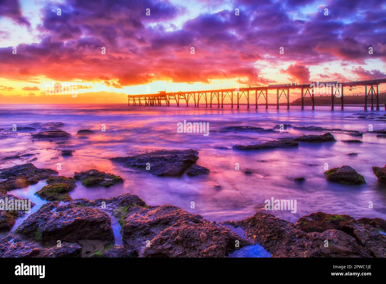 Spectacular seascape sunrise at Catherine hill bay beach towards