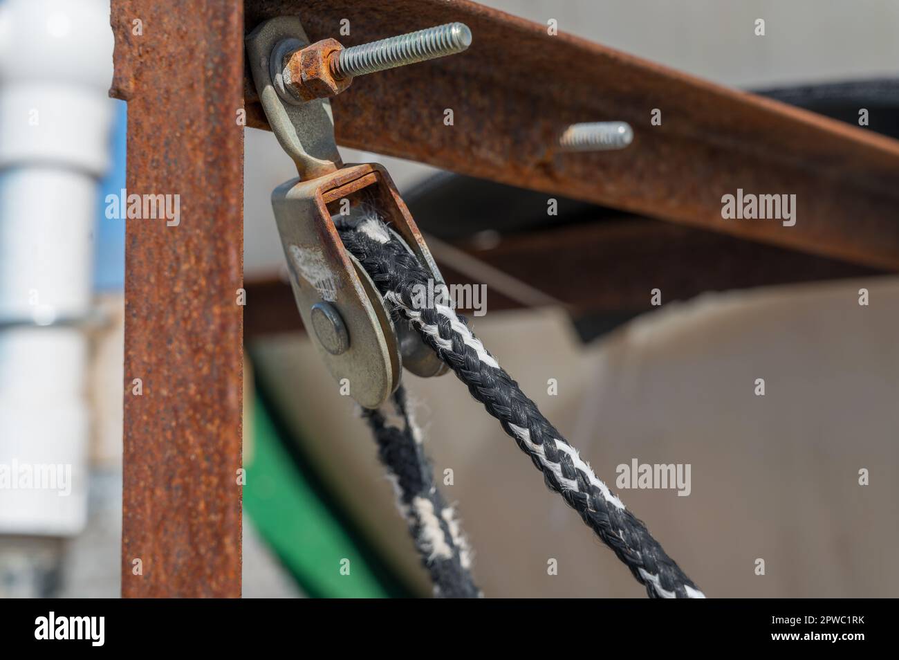 Small block and tackle under tension being used to control the movement of an object Stock Photo