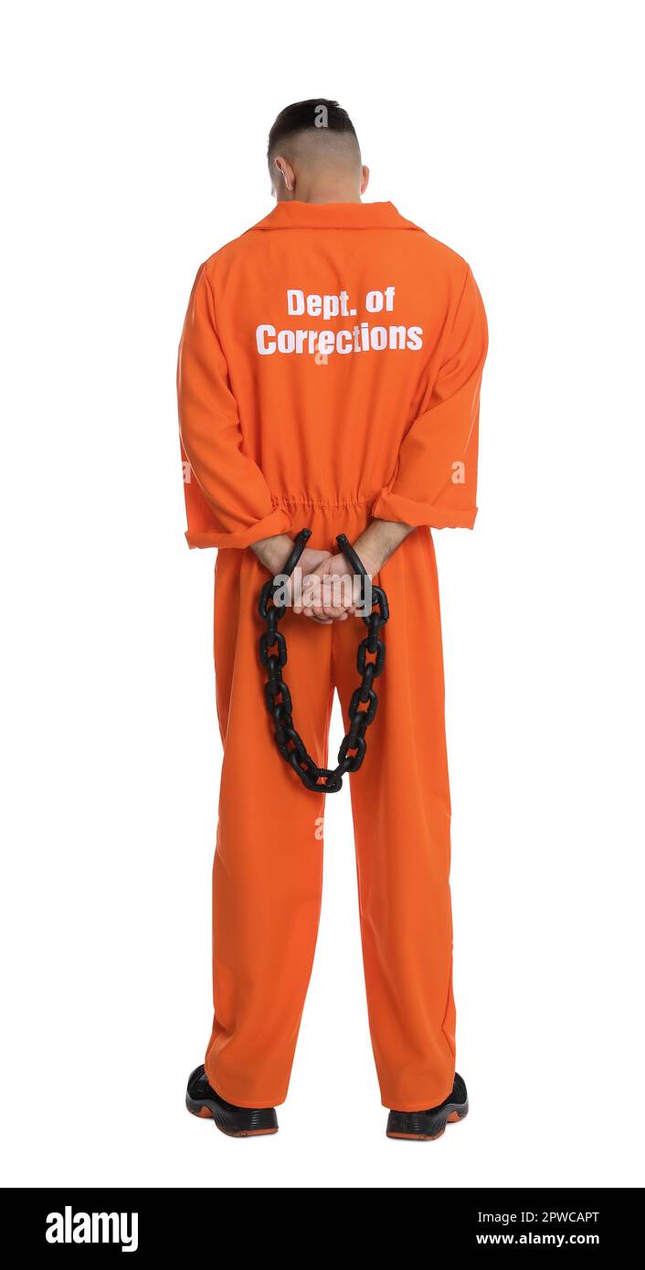Prisoner in orange jumpsuit with chained hands on white background, back view Stock Photo