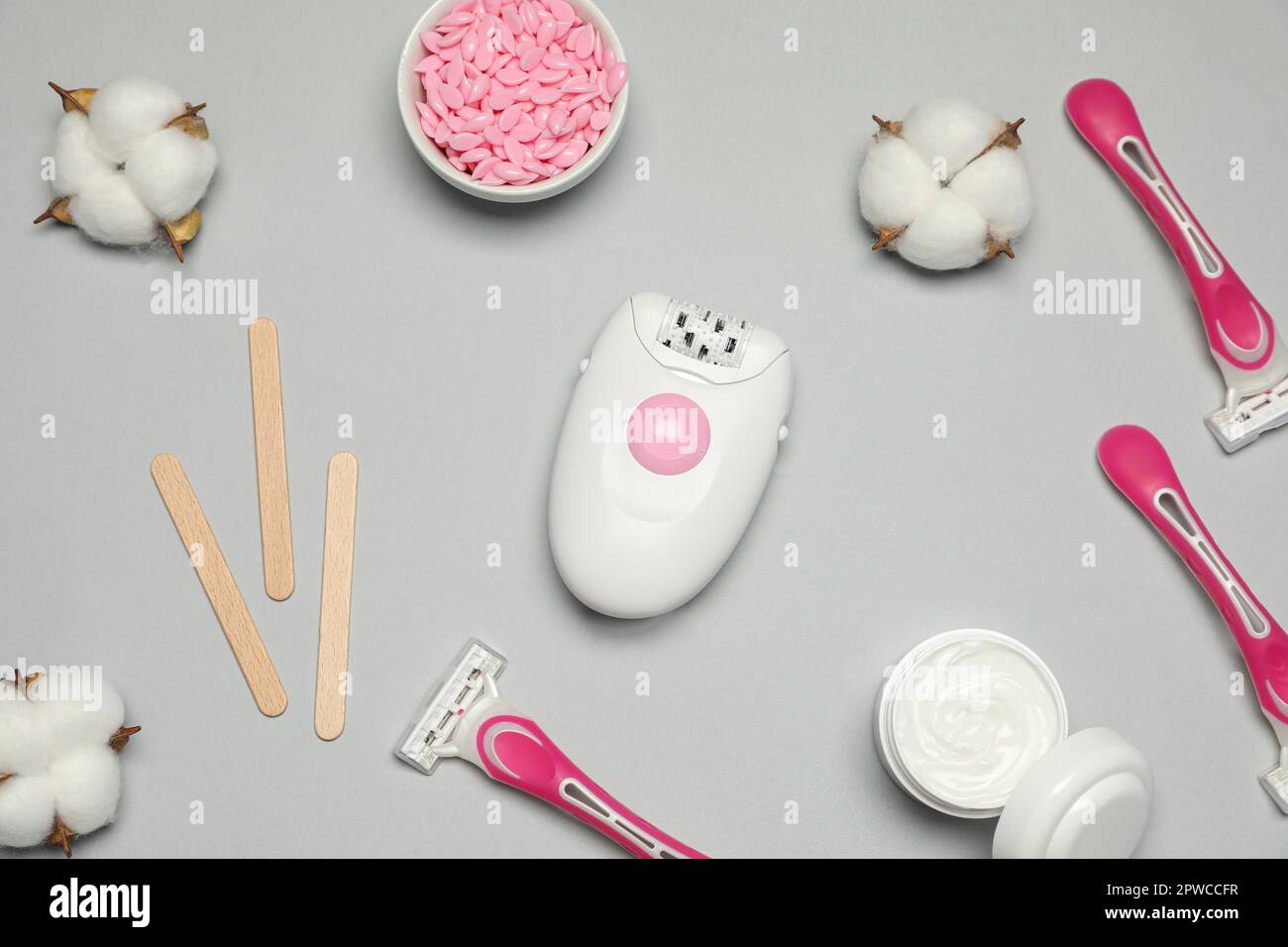 Flat lay composition with different epilation products on light grey ...