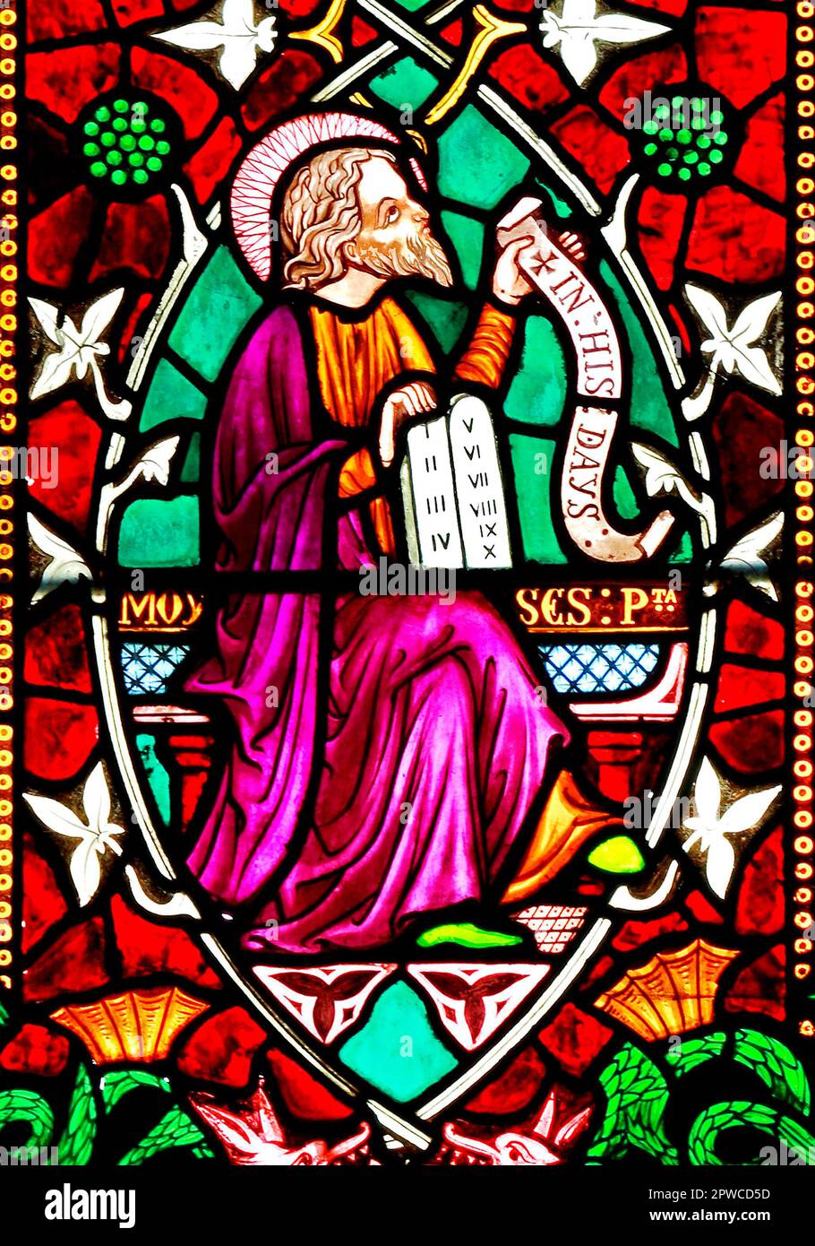 Moses, with 10 Commandments tablet, stained glass window by Frederick Preedy, 1862, detail of Tree of Jesse, Old Hunstanton church, Norfolk Stock Photo