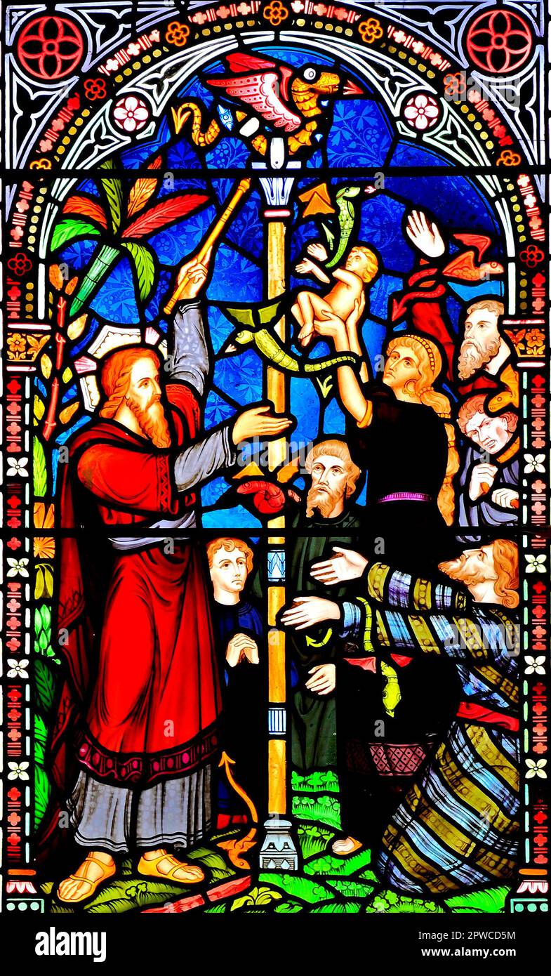 Moses with bronze snake on pole, Old Hunstanton,  detail of stained glass window by Frederick Preedy, 1867, Norfolk, England, UK Stock Photo