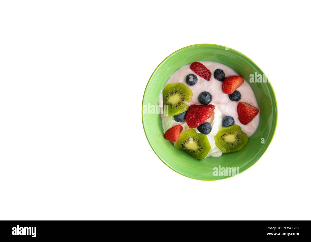 Bowl of yogurt with fresh fruit shot from above isolated on a white background. Stock Photo