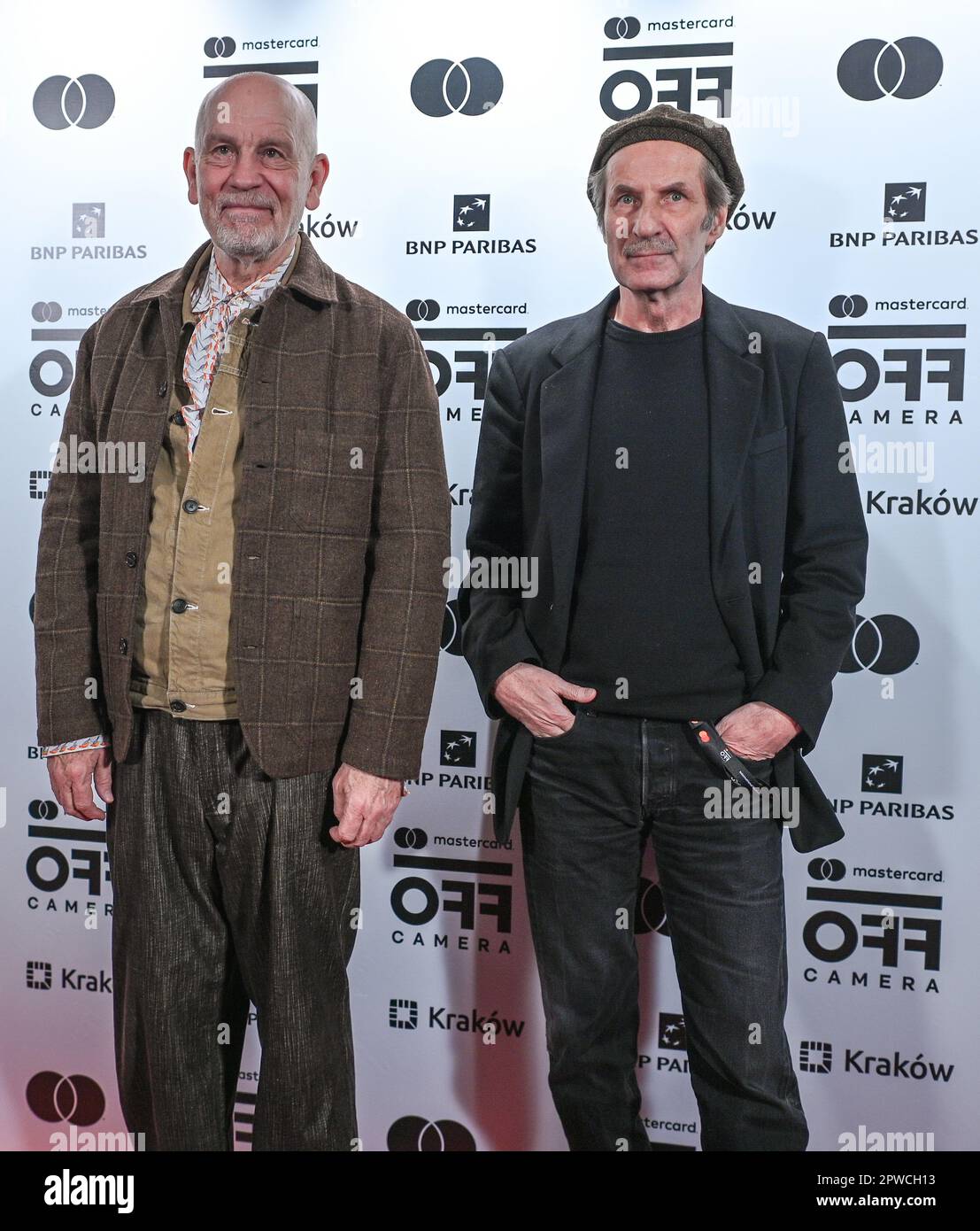 KRAKOW, POLAND - APRIL 28, 2023: American actor John Malkovich (L) arrives at the screening of 'Last Call' accompanied by one of the movie producers, Jacek Szumlas (R), are seen at the opening gala of the International Festival of Independent Cinema Mastercard OFF CAMERA in Krakow, on April 28, 2023, in Krakow, Poland. (Photo by Artur Widak/NurPhoto) Stock Photo
