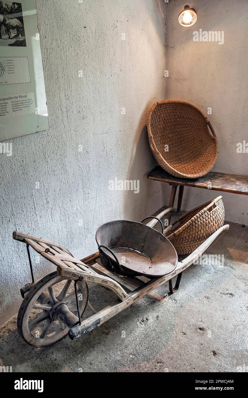 Old wooden wheelbarrow, Jexhof Farm Museum in Schoengeising, Bavaria, Germany Stock Photo
