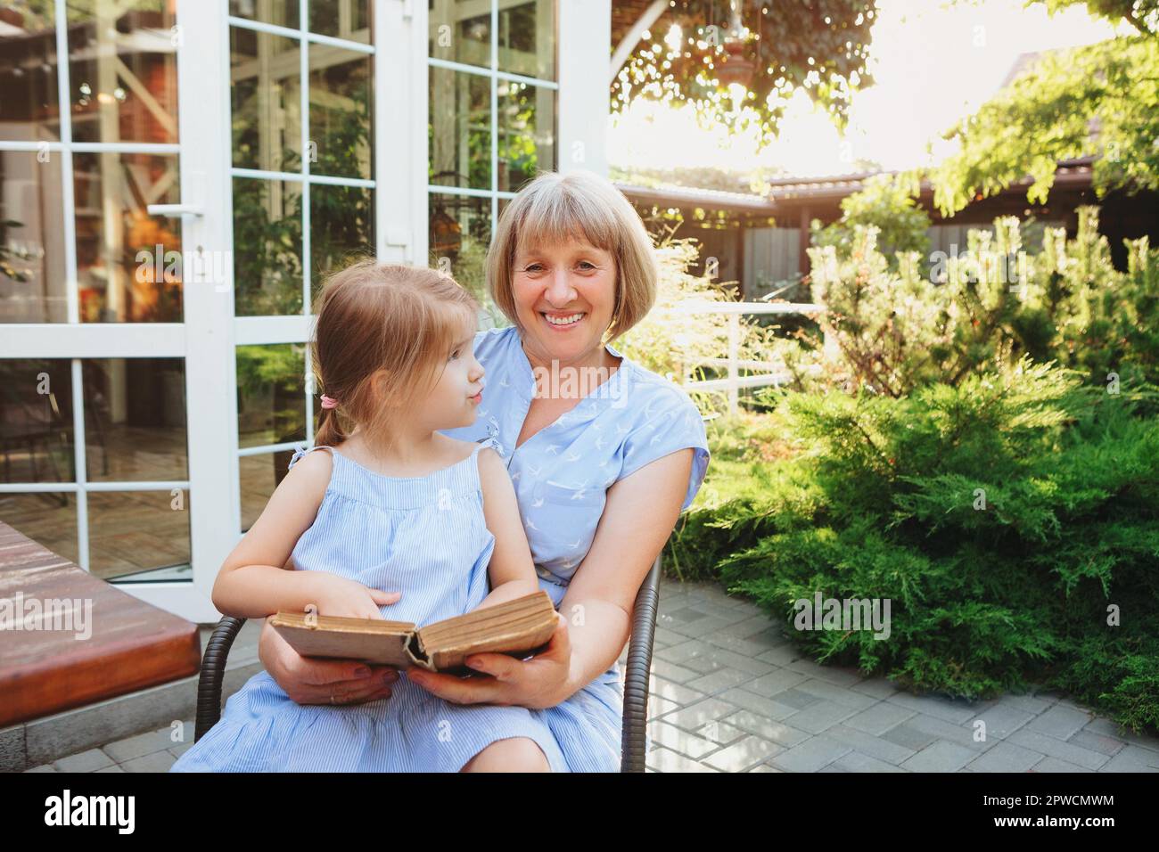 Senior grandmother and grandchild spending time together on sunny