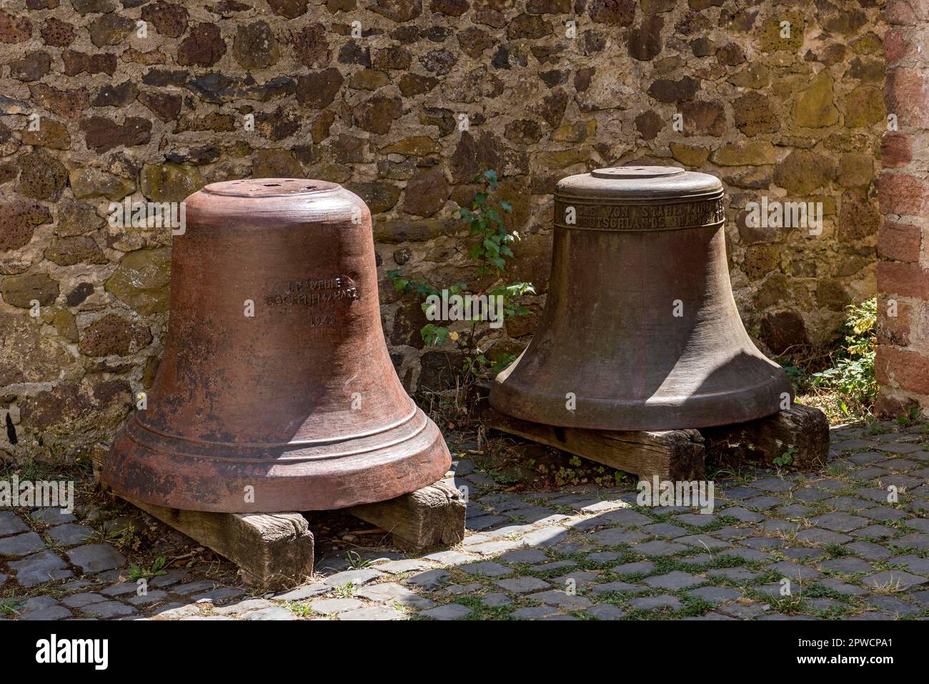 Church bells, tower bells, bells in front of the workshop of tower clock maker Ritzert, Hessenpark open-air museum, Neu-Anspach, Taunus, Hesse Stock Photo