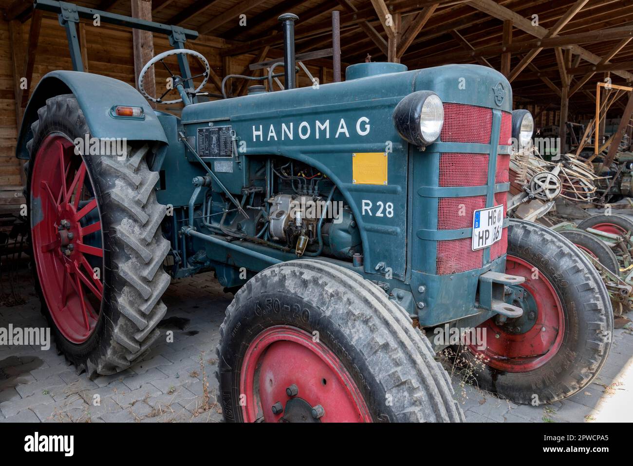 Vintage tractor, Hanomag R28, year of construction 1952, remise, Hessenpark open-air museum, Neu-Anspach, Taunus, Hesse, Germany Stock Photo