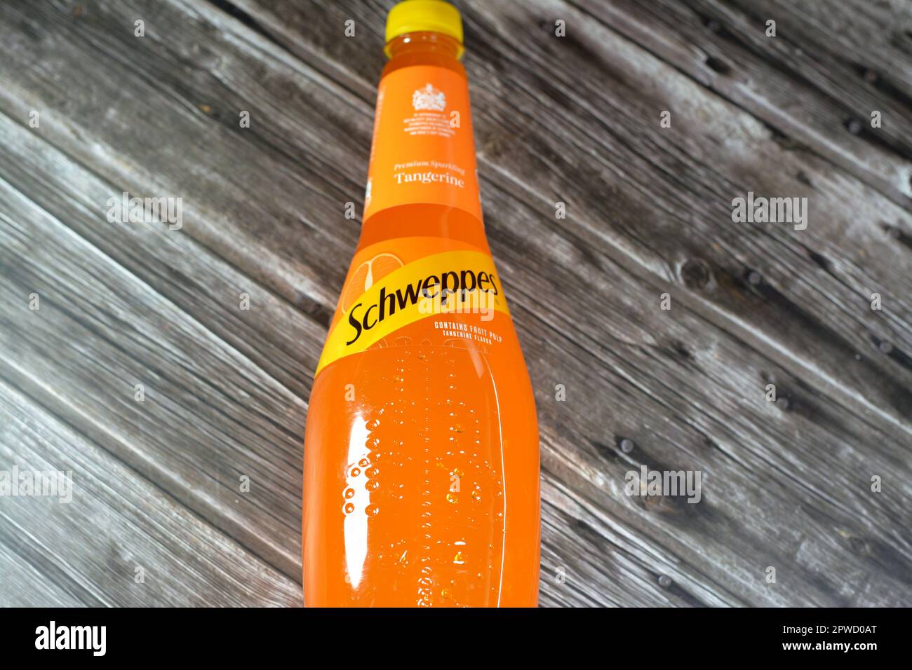 Cairo, Egypt, April 28 2023: Schweppes premium sparkling soft drink contains fruit pulp tangerine flavor, Schweppes is a beverage brand that originate Stock Photo