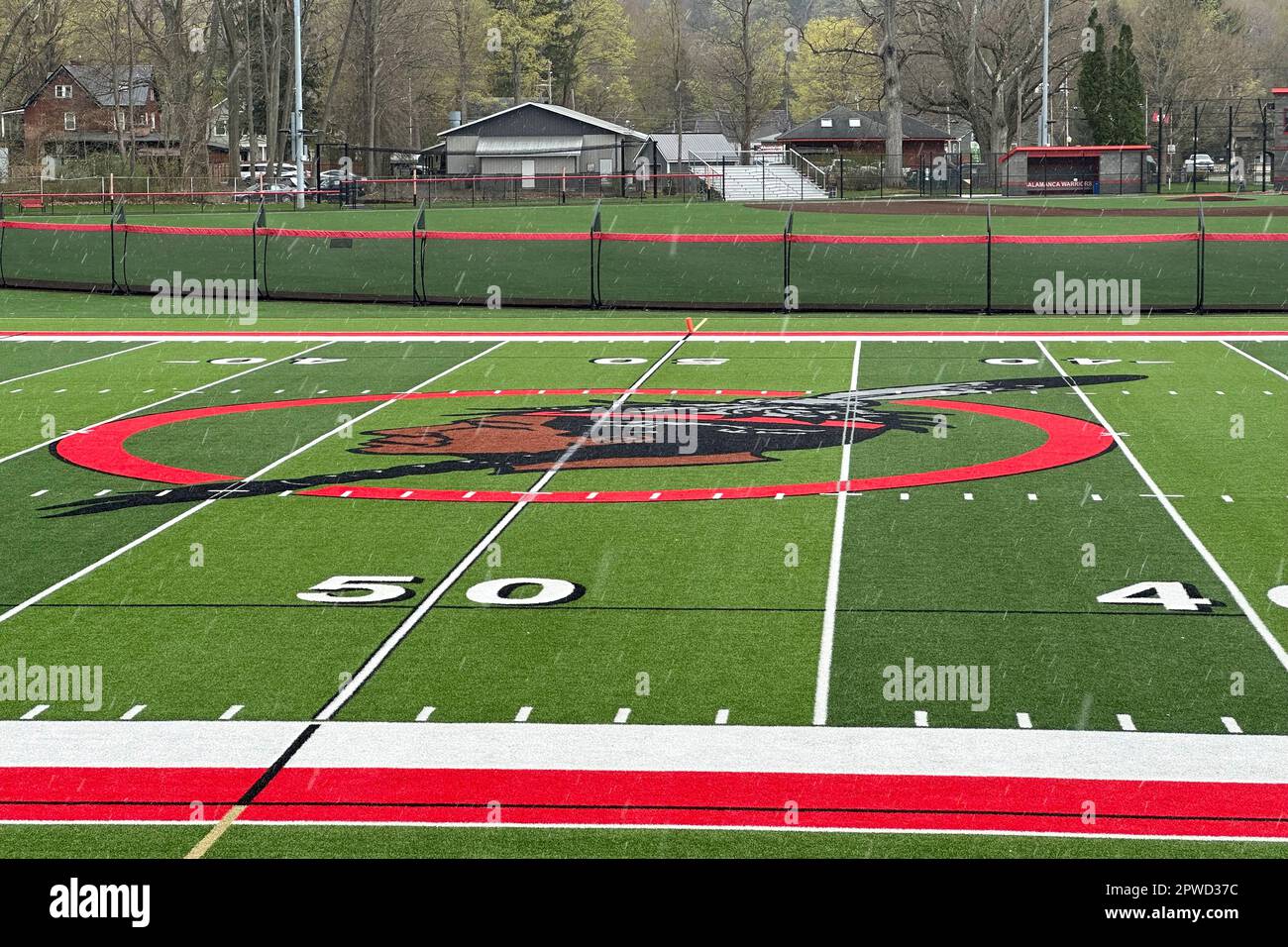The logo of the Salamanca City Central School District is seen on the football field turf in