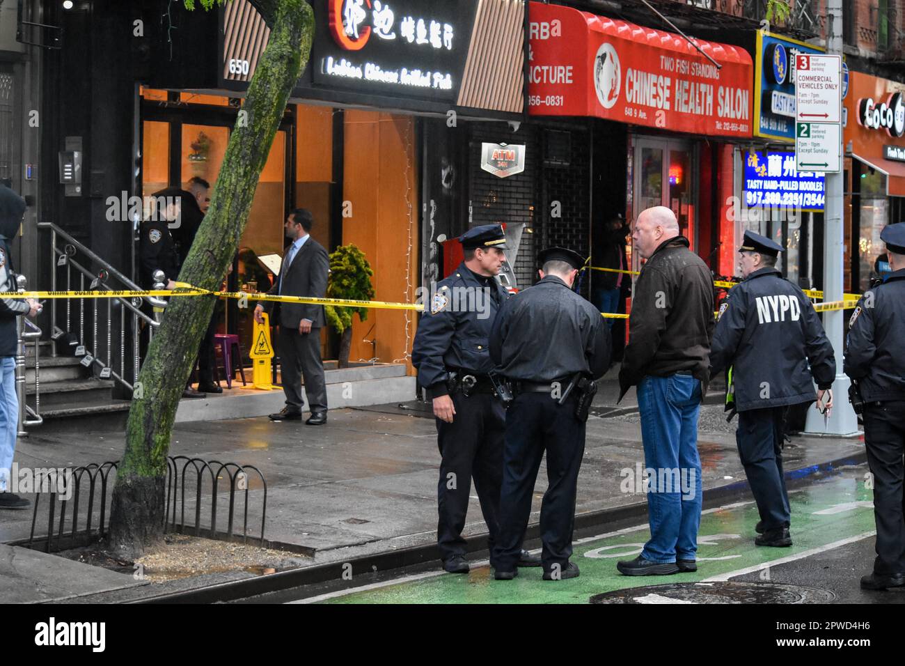 Manhattan, United States. 29th Apr, 2023. A man and police officers seen during the investigation. Police investigate the shooting incident. Shooting in Manhattan, New York, United States on April 29, 2023. At 17:43 Saturday evening one person was shot in the hip and shoulder near the area of 9th Avenue and West 46th Street. According to the New York City Police Department, the person shot is in stable condition. No suspects are captured at this time. (Photo by Kyle Mazza/SOPA Images/Sipa USA) Credit: Sipa USA/Alamy Live News Stock Photo