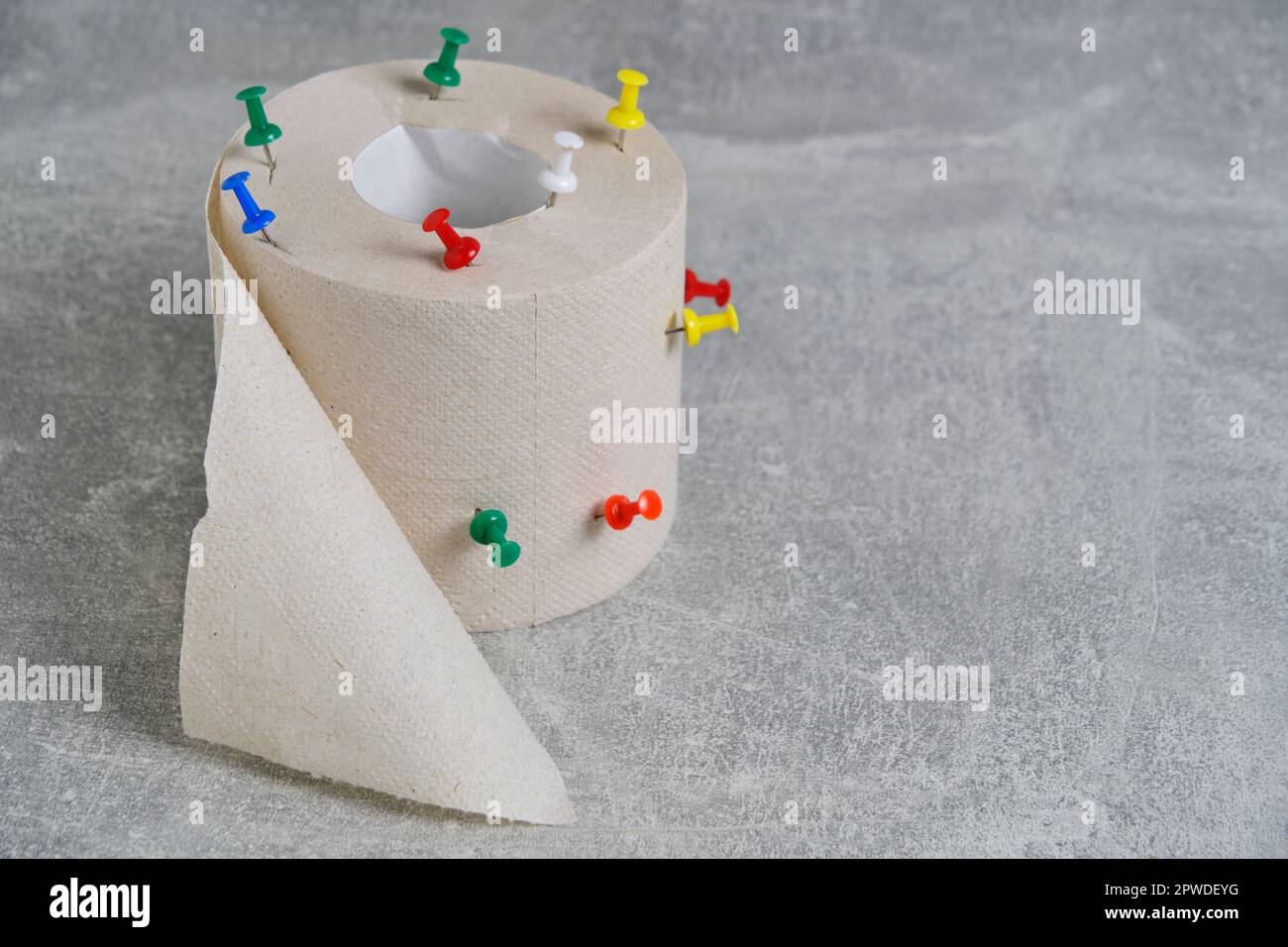 Toilet paper with sharp buttons.Concept hemorrhoid problem Stock Photo