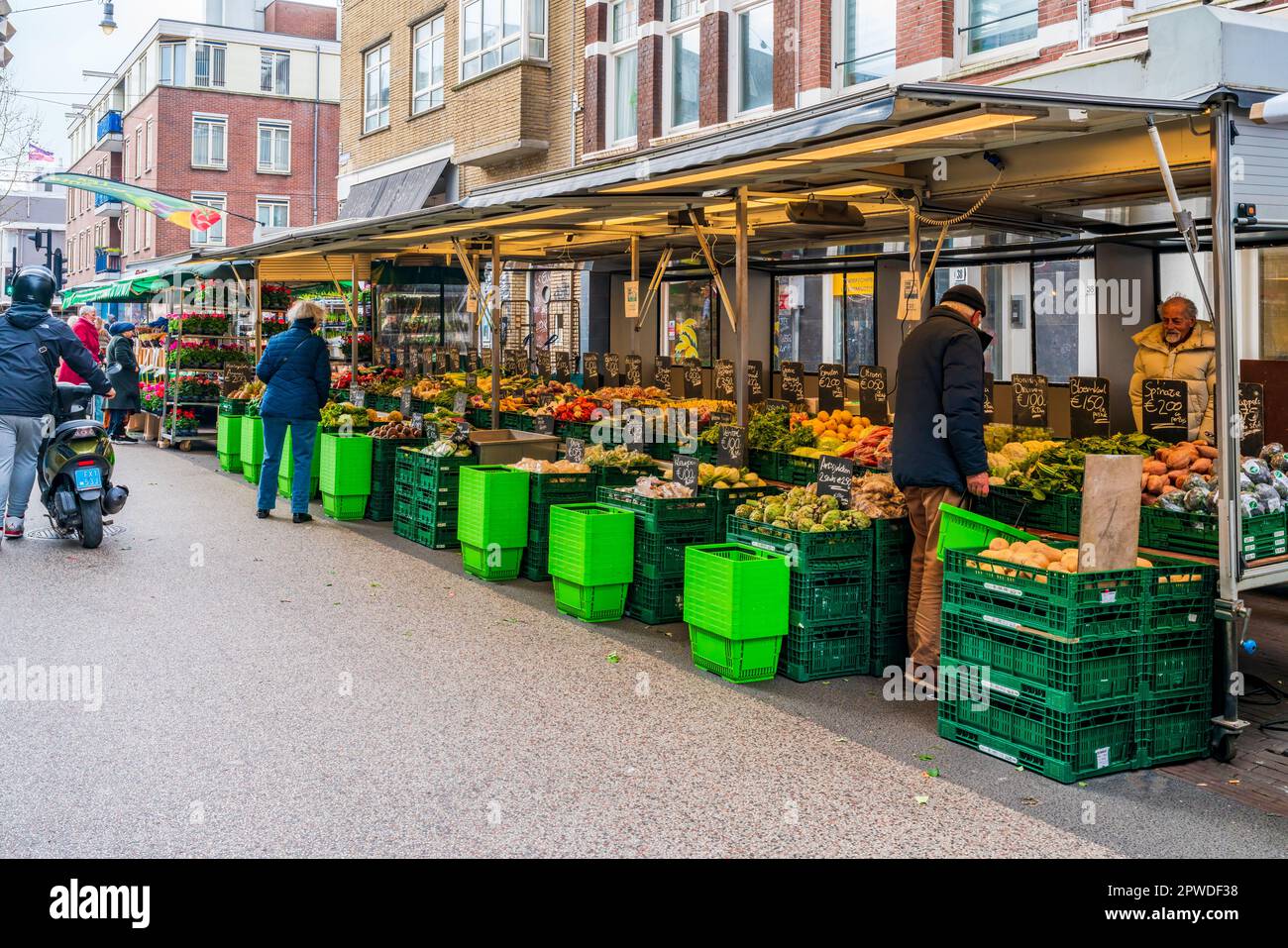 AMSTERDAM, HOLLAND APRIL 18, 2023 Shoppers buying fresh produce at