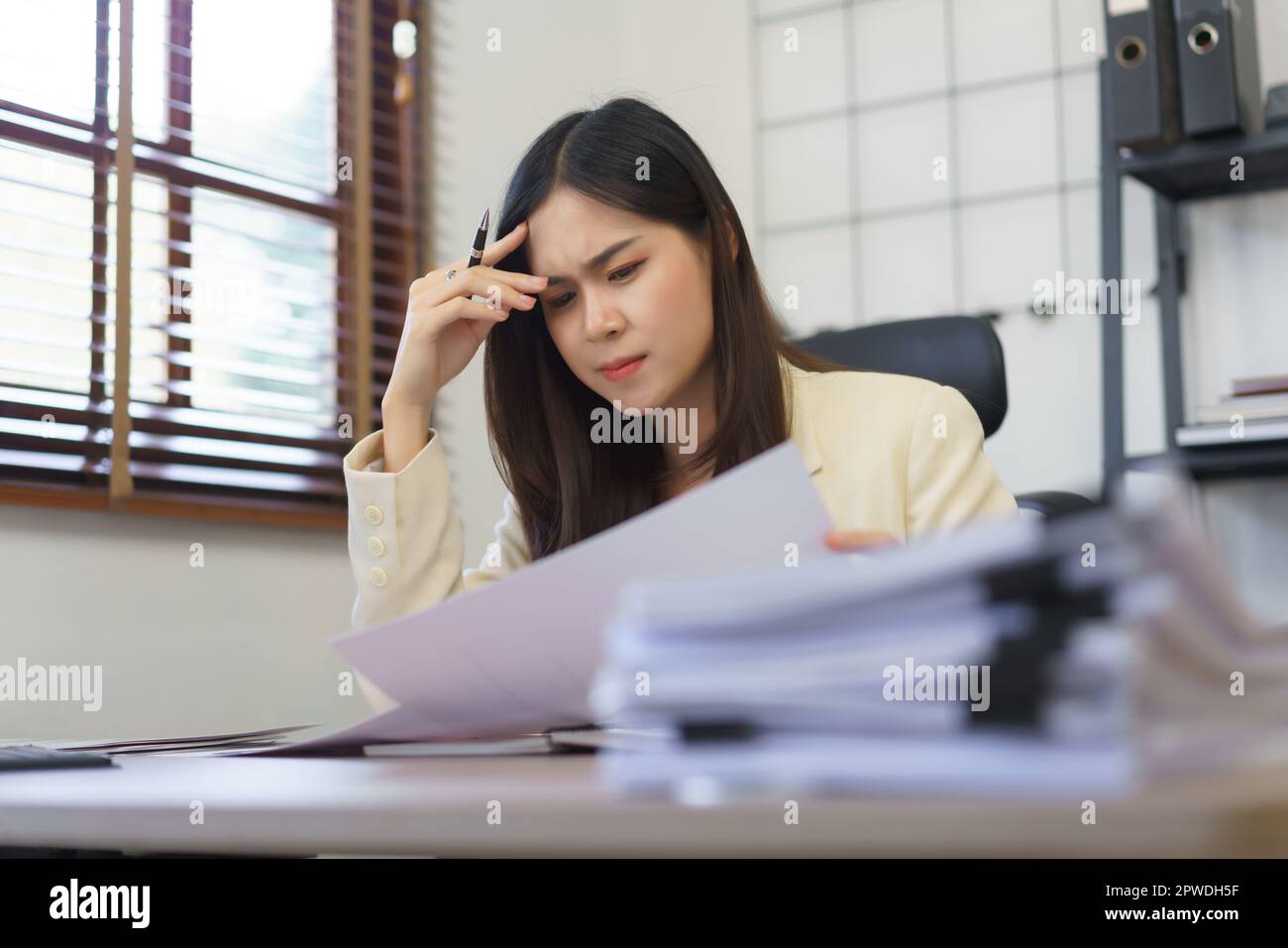 Secretary Reading Secretary concept, Female secretary feeling stressed and headache while ...
