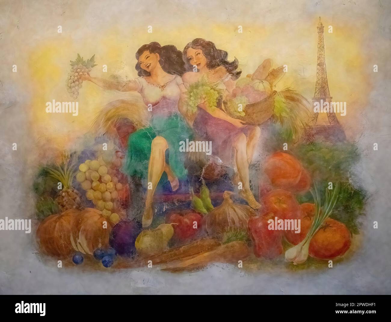 Mural depicting french women with a bounty of fruit and vegetables and the Eiffel Tower on a wall of the Paris Las Vegas Hotel and Casino in Las Vegas. Stock Photo