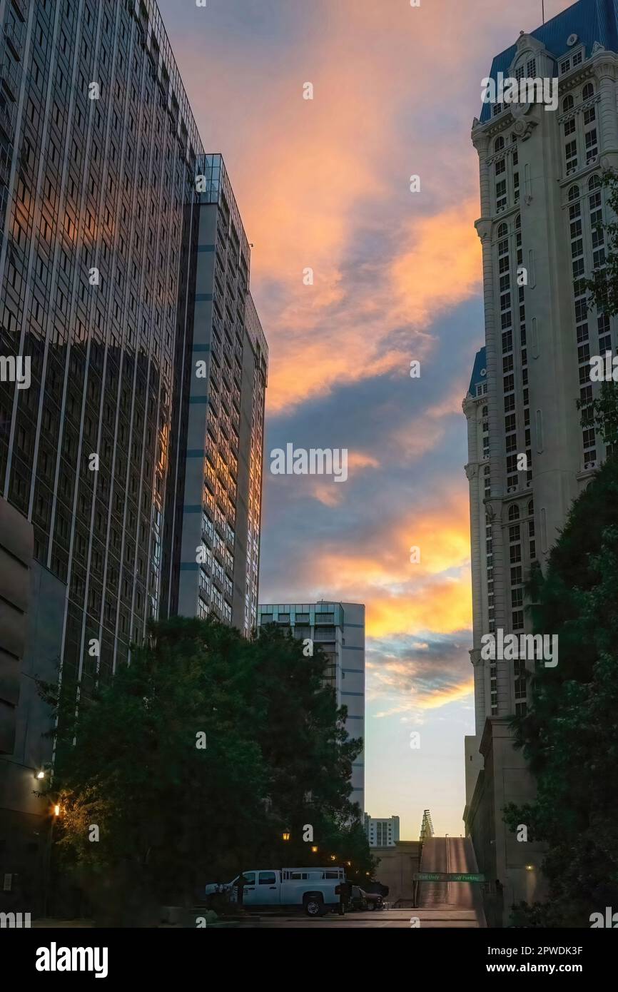 Brilliant colorful morning sky between two tall buildings on a side street from Las Vegas Blvd., in Las Vegas, Nevada USA. Stock Photo