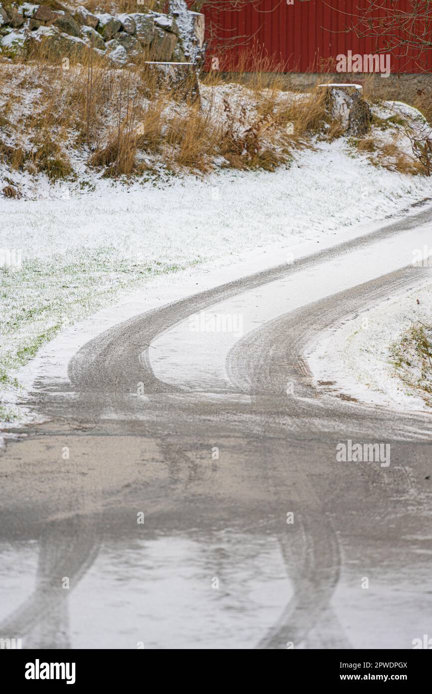 Tyre tracks on an icy road Stock Photo - Alamy