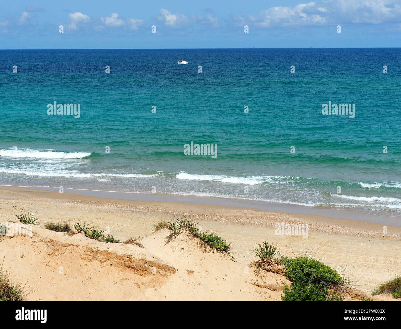 Sandy beach and bright colors of the Mediterranean Sea in Israel. Stock Photo