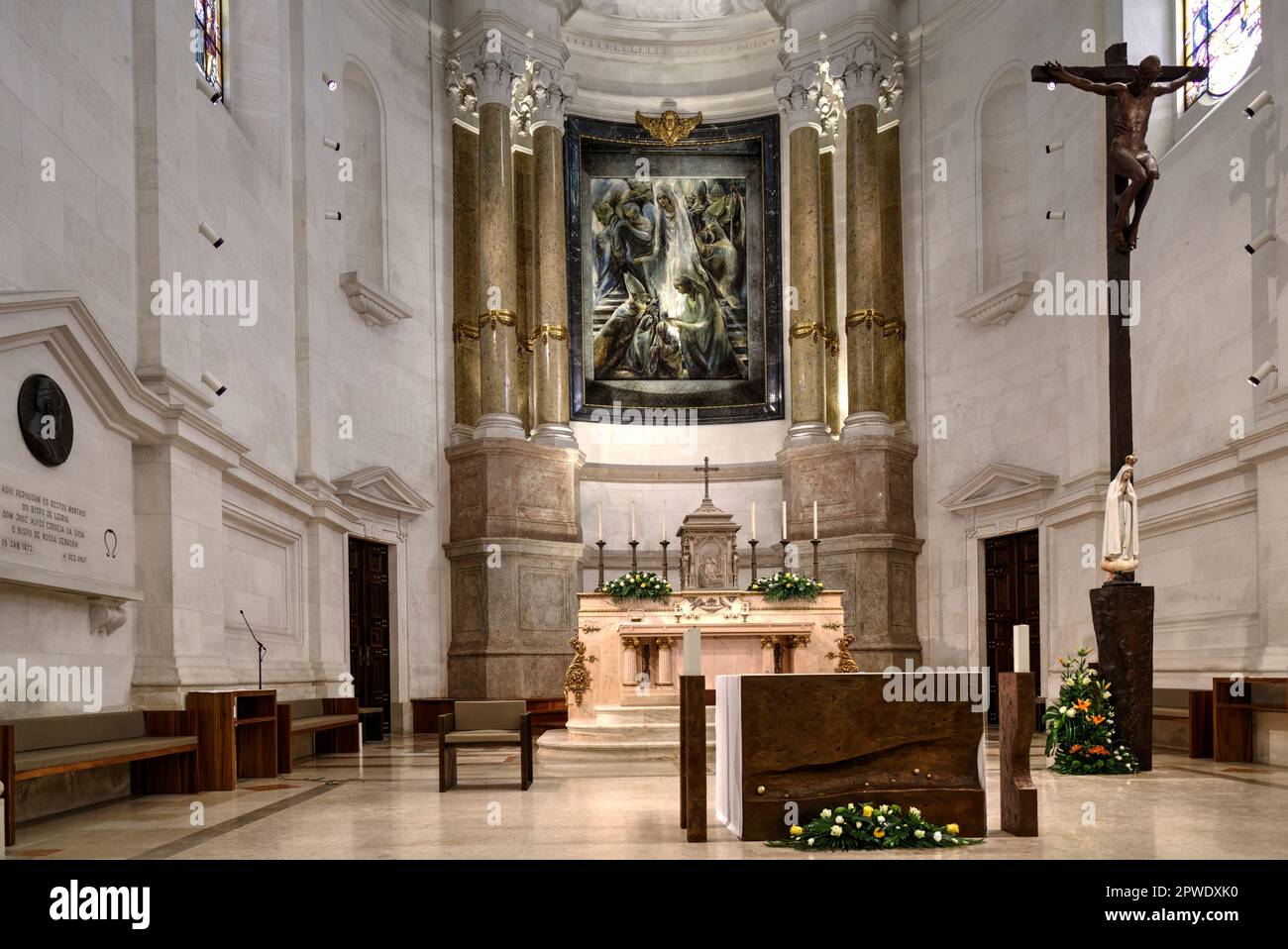 Fatima, Portugal - August 15, 2022: Close up of altar within Sanctuary of Our Lady of the Rosary of Fatima Basilica with congregation some motion blur Stock Photo
