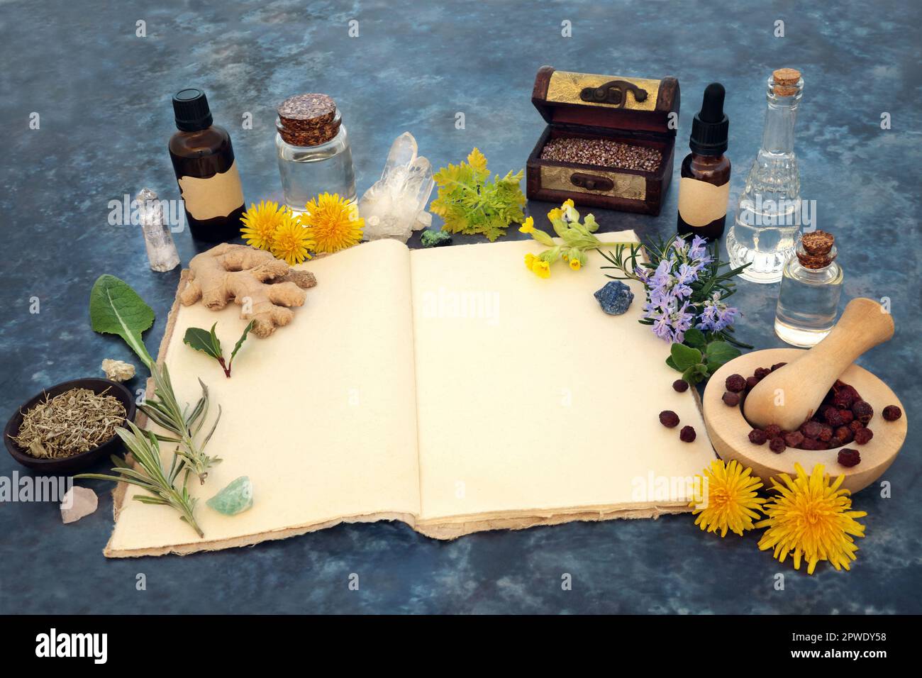Naturopathic herbal plant medicine for natural healing with hemp recipe book, essential oils, crystals, herbs flowers. Stock Photo