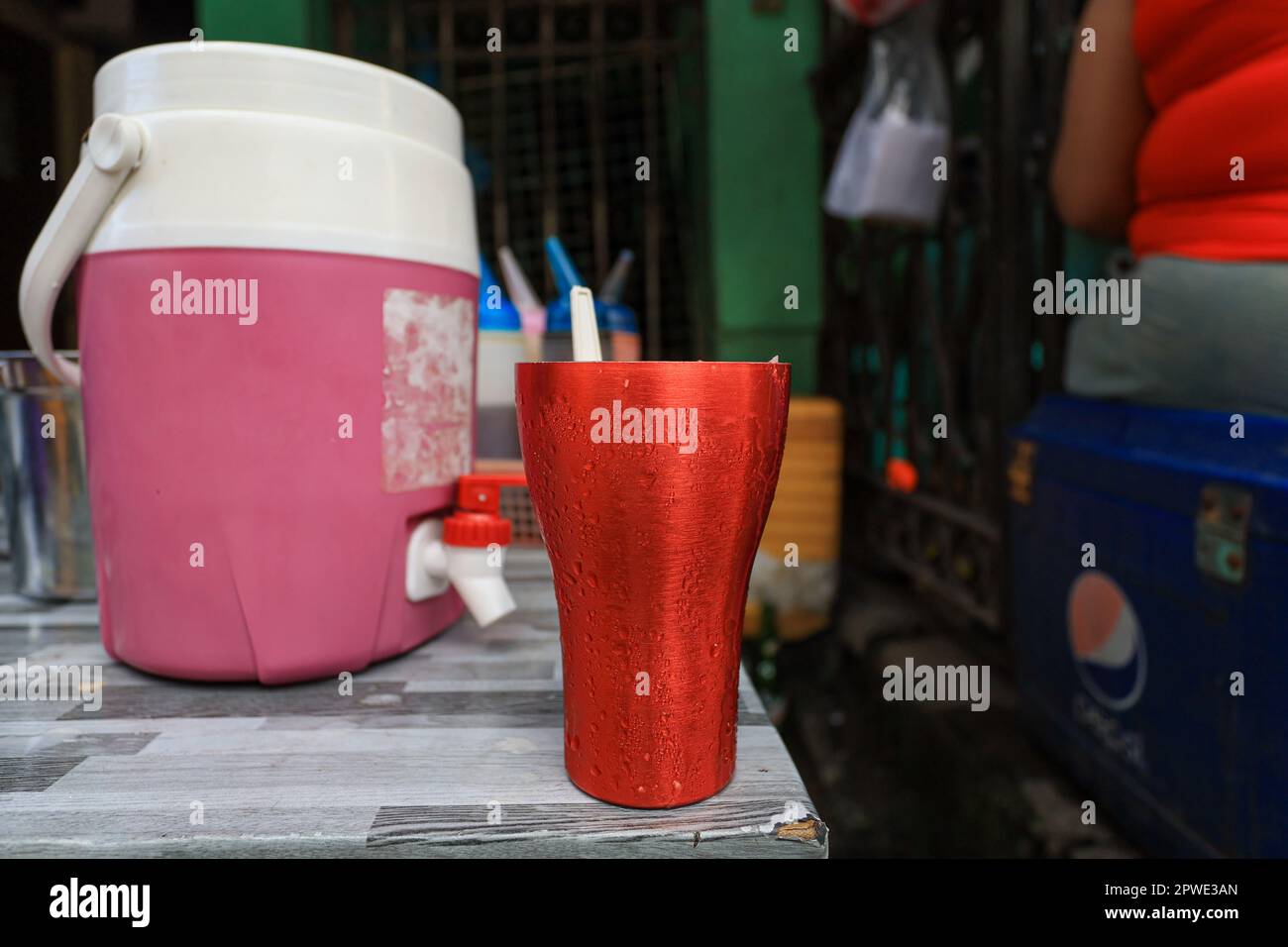 Metro Manila, Manila, The Philippines. 30th Apr, 2023. An iced beverage is served at a food store, at a highly densely populated residential area in Metro Manila, amid extremely hot weather. The multiple layers of concrete among roads and buildings and the uses of metals for construction in the Philippines are said to have been contributed to the urban heat island effect, making the country much hotter than ever. Asia has also been experiencing weeks of endless heat. (Credit Image: © Daniel Ceng Shou-Yi/ZUMA Press Wire) EDITORIAL USAGE ONLY! Not for Commercial USAGE! Credit: ZUMA Press, Inc./A Stock Photo