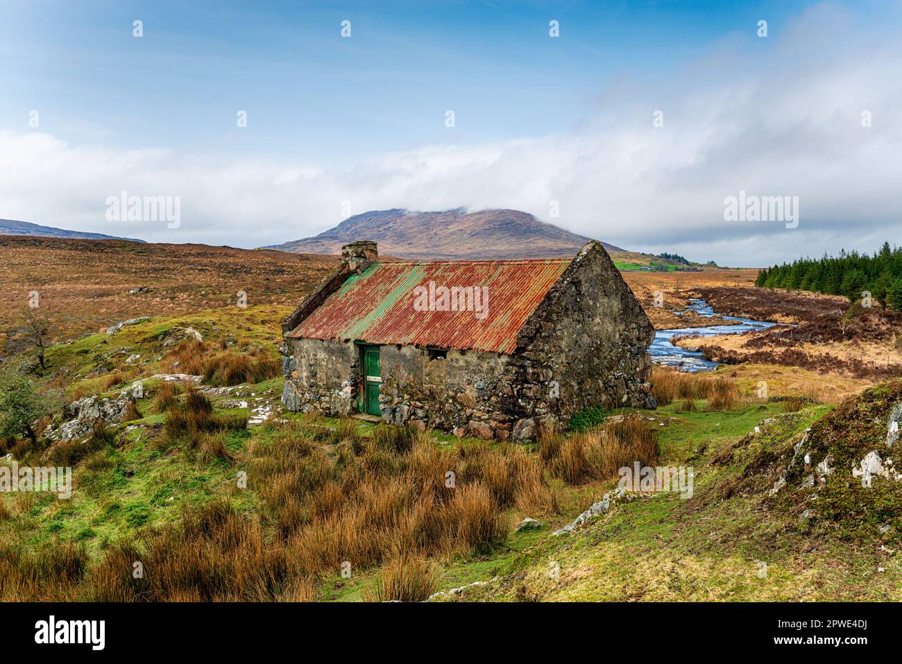 An old cottage with a rusty roof at Maam Cross in Connemara national park in Galway on the west coast of Ireland Stock Photo