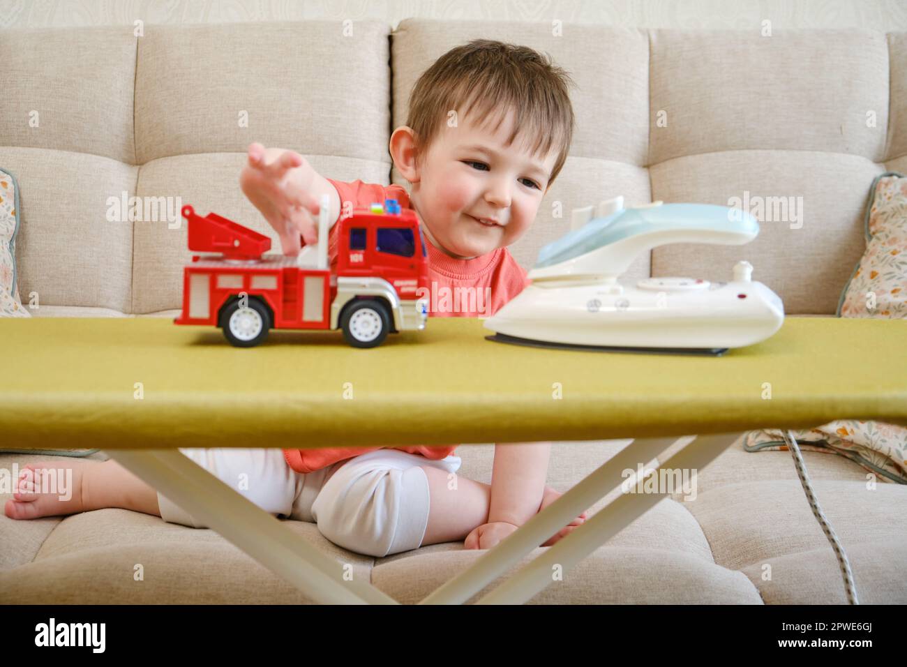 Playing with a hot iron in the living room is not safe for a baby