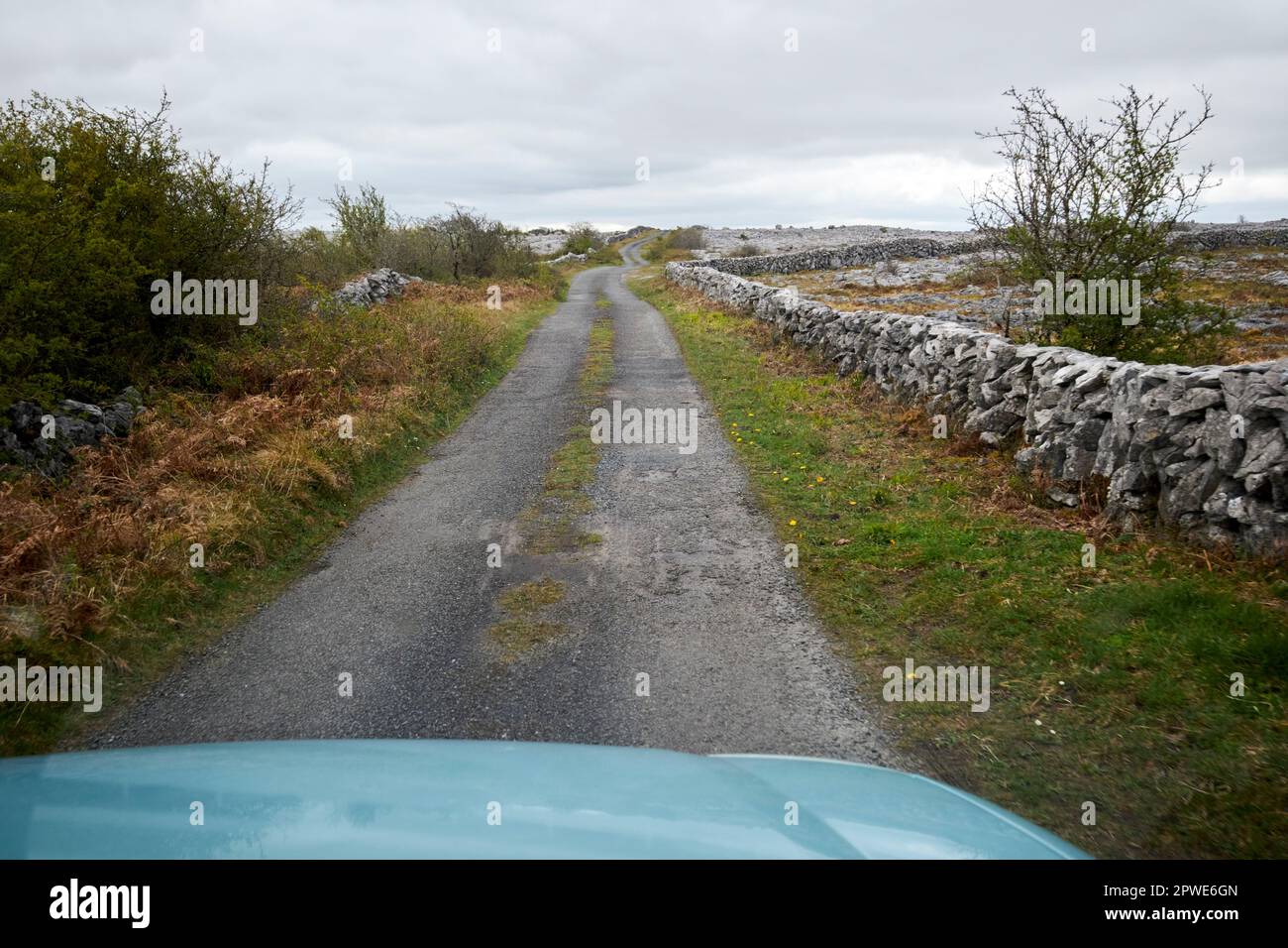 driving off the beaten track small country road through the burren county clare republic of ireland Stock Photo