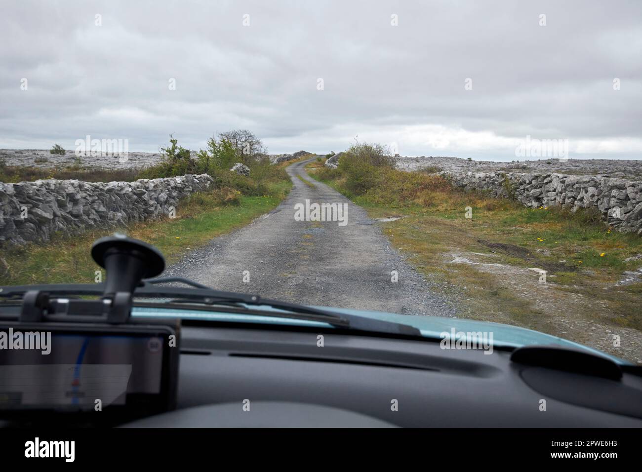 driving off the beaten track small country road through the burren county clare republic of ireland Stock Photo