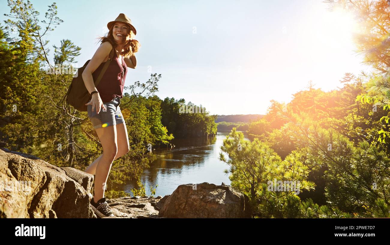 Wander without purpose or reason. a young woman out hiking Stock Photo ...