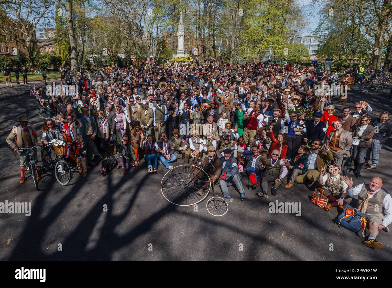 Participants of the Tweed Run 2023 event in London pose for a group photograph. Stock Photo