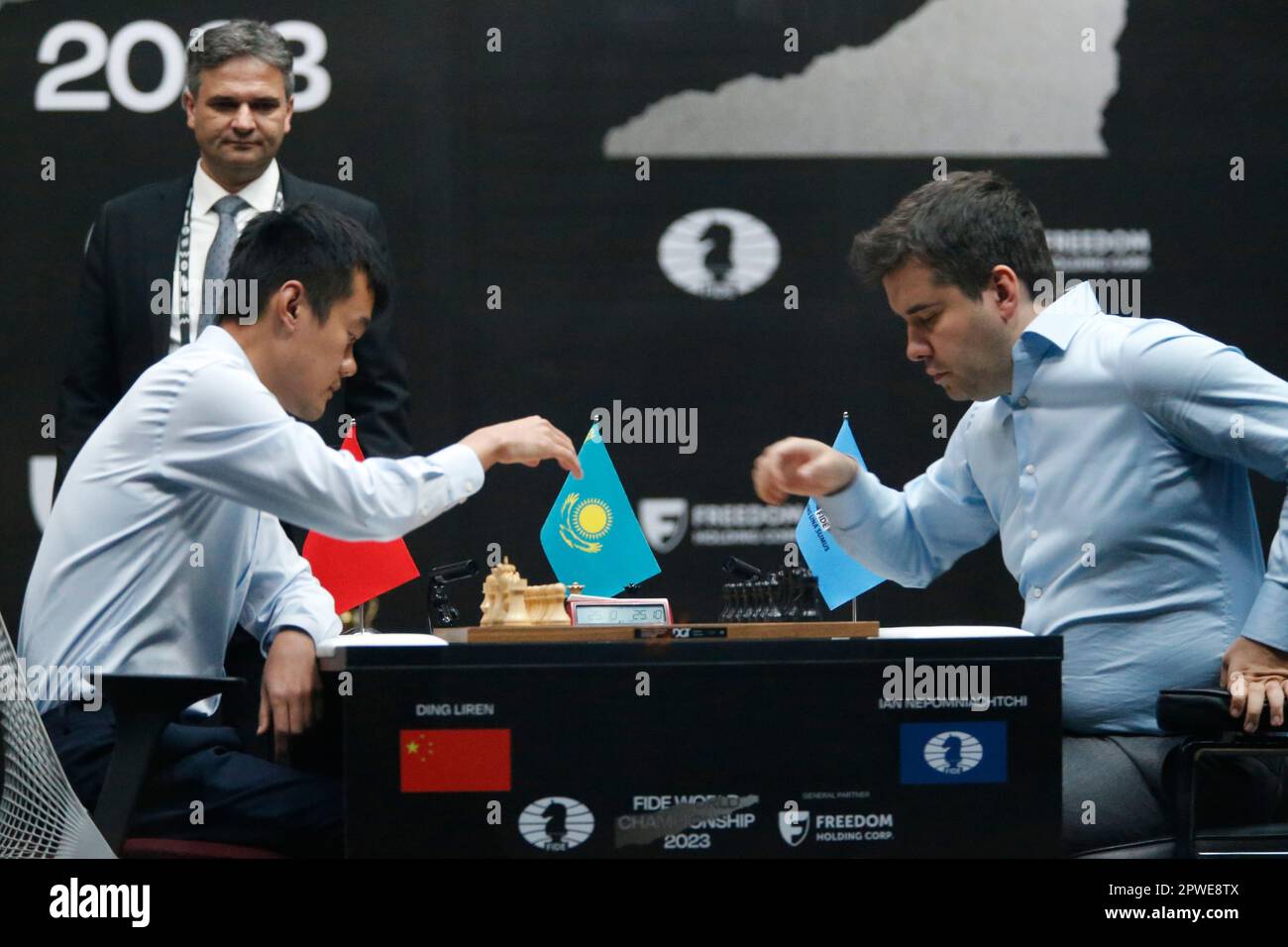Russia's Ian Nepomniachtchi, right, and China's Ding Liren play during